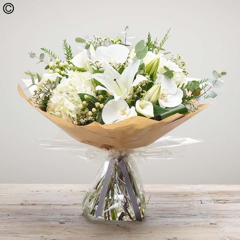 Sympathy hand tied made with the finest flowers.