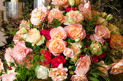 Pink, red, white and green funeral flower arrangement