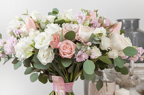 Wedding bridal bouquet with pink ribbon